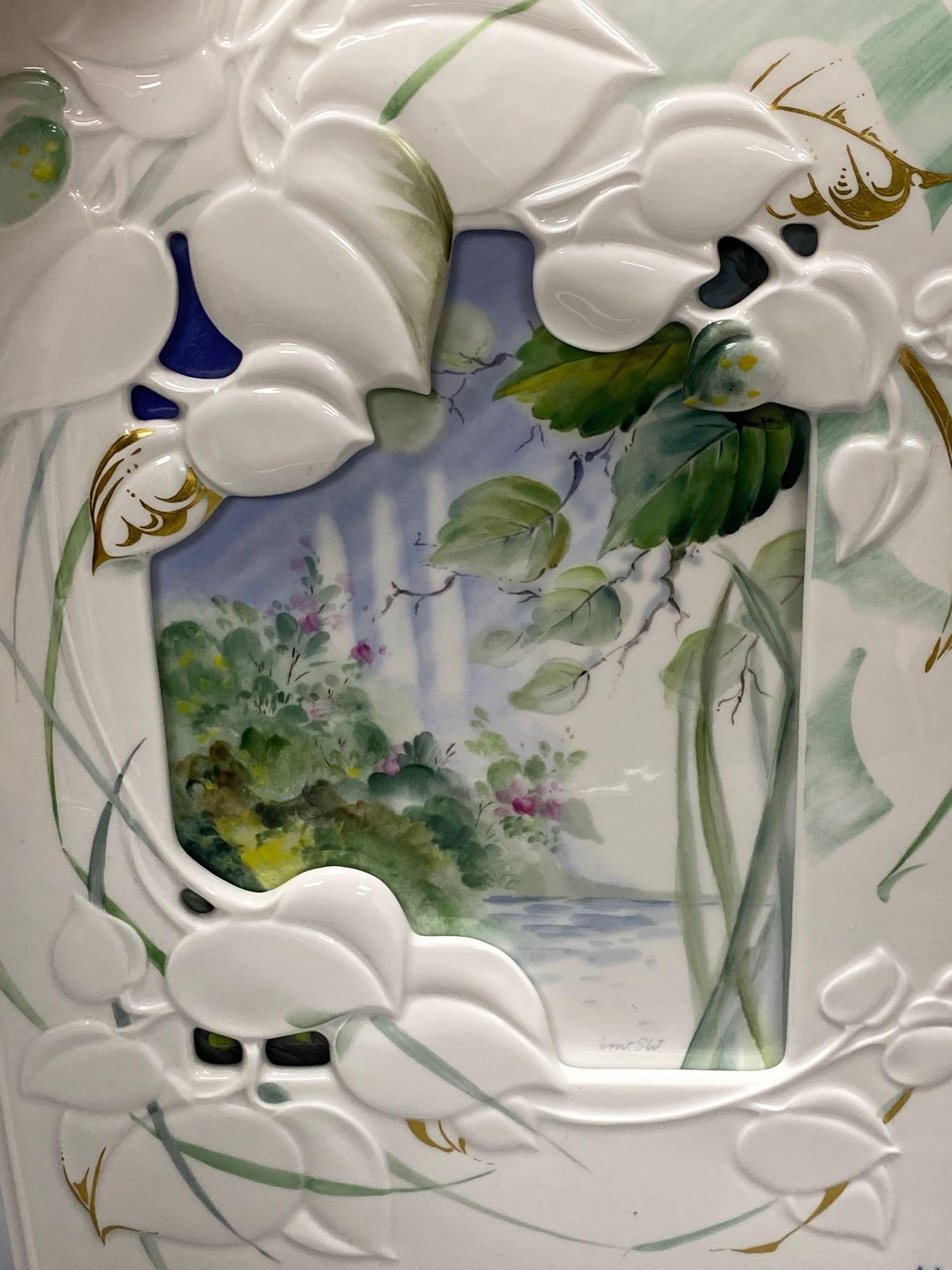 A Meissen photograph frame with inset painted plaque, signed, 35 x 25cm